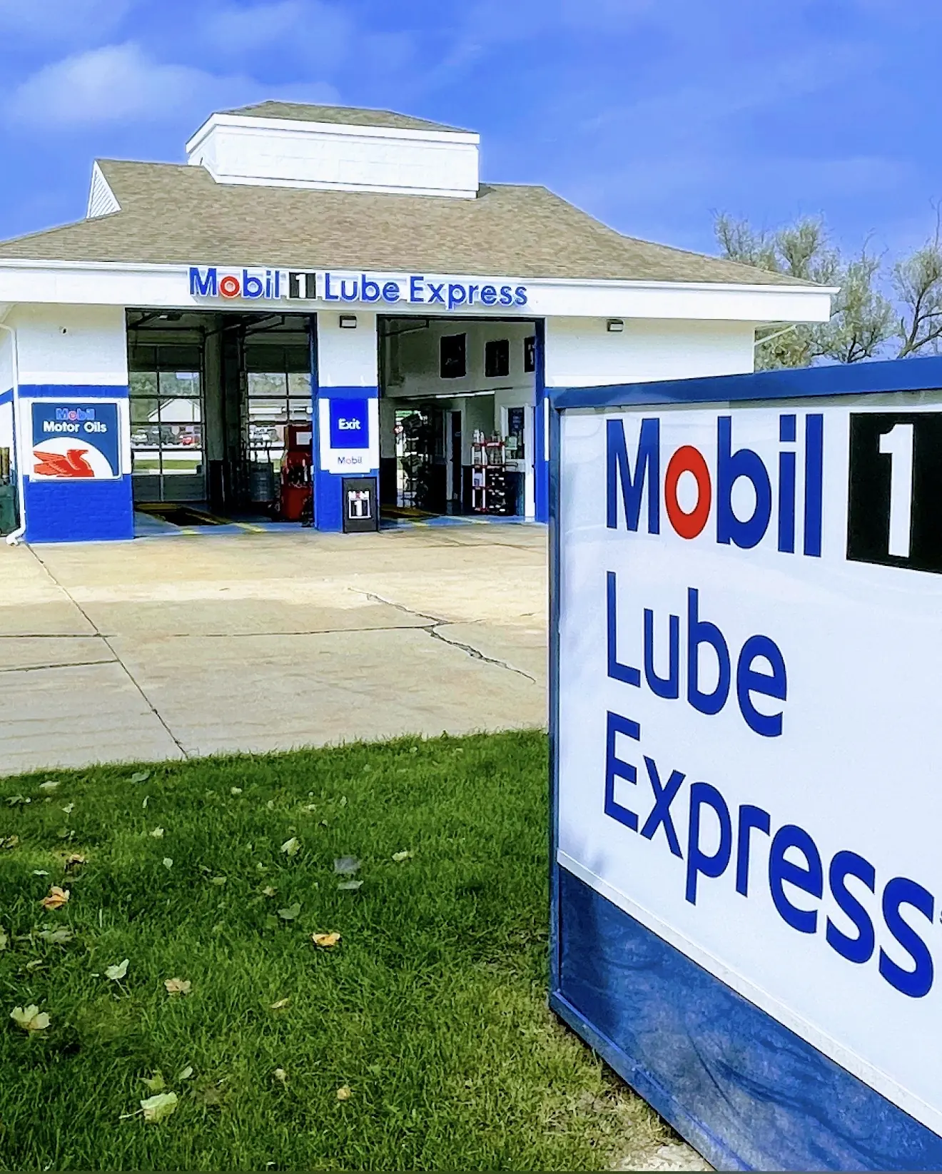 Mobil 1 Lube Express roadside sign with the Marysville shop in the background